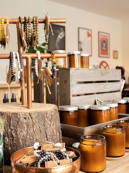 A glimpse into a stylish lifestyle store featuring handmade candles and jewelry. | © Bohemian Soul Beehive