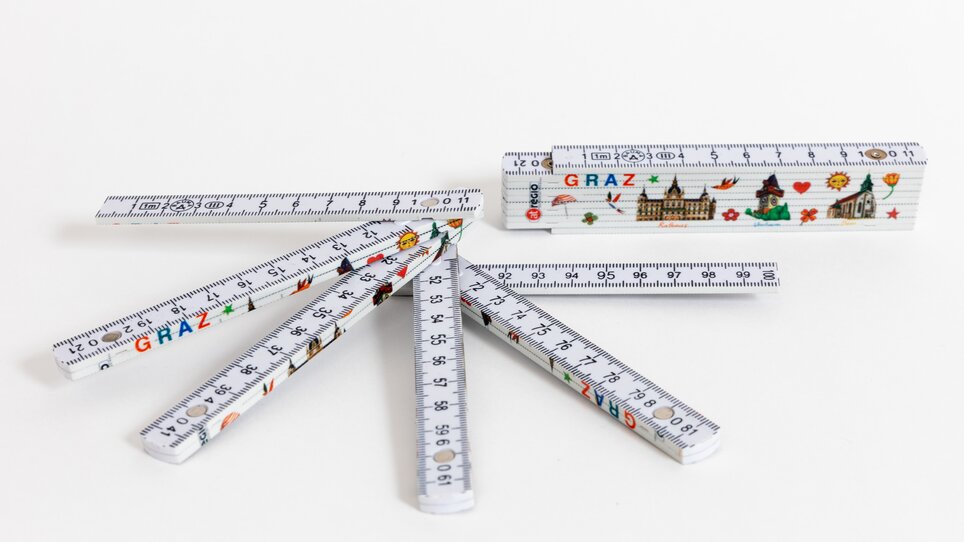 Righelli colorati con motivi di Graz e varie attrazioni. | © Graz Tourismus - Harry Schiffer