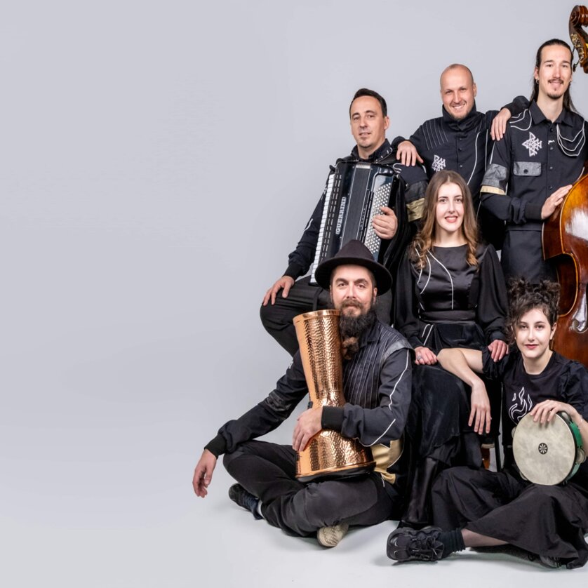Divanhana | © Divanhana Six musicians pose with instruments including a double bass and accordion. | © Divanhana