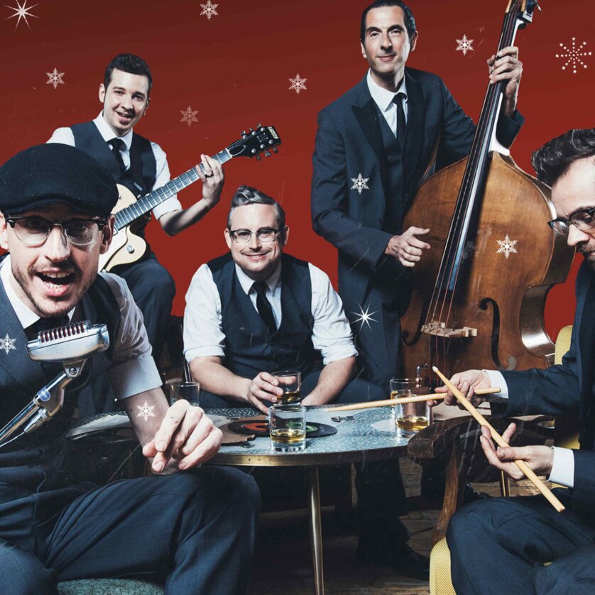 Oldschoolbasterds Vintage Christmas | © Marija Kanizaj Five-piece vintage band in suits with instruments, red background and snowflakes | © Marija Kanizaj