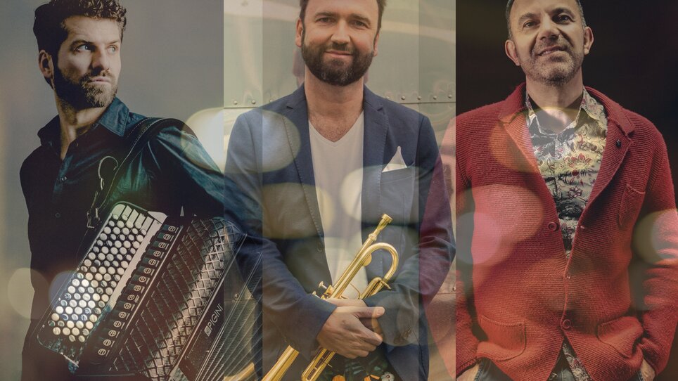Three musicians: accordion player, trumpeter, and another musician in colorful outfits. | © Andrej Grilc, Thomas Radlwimmer, Nancy Horovitz