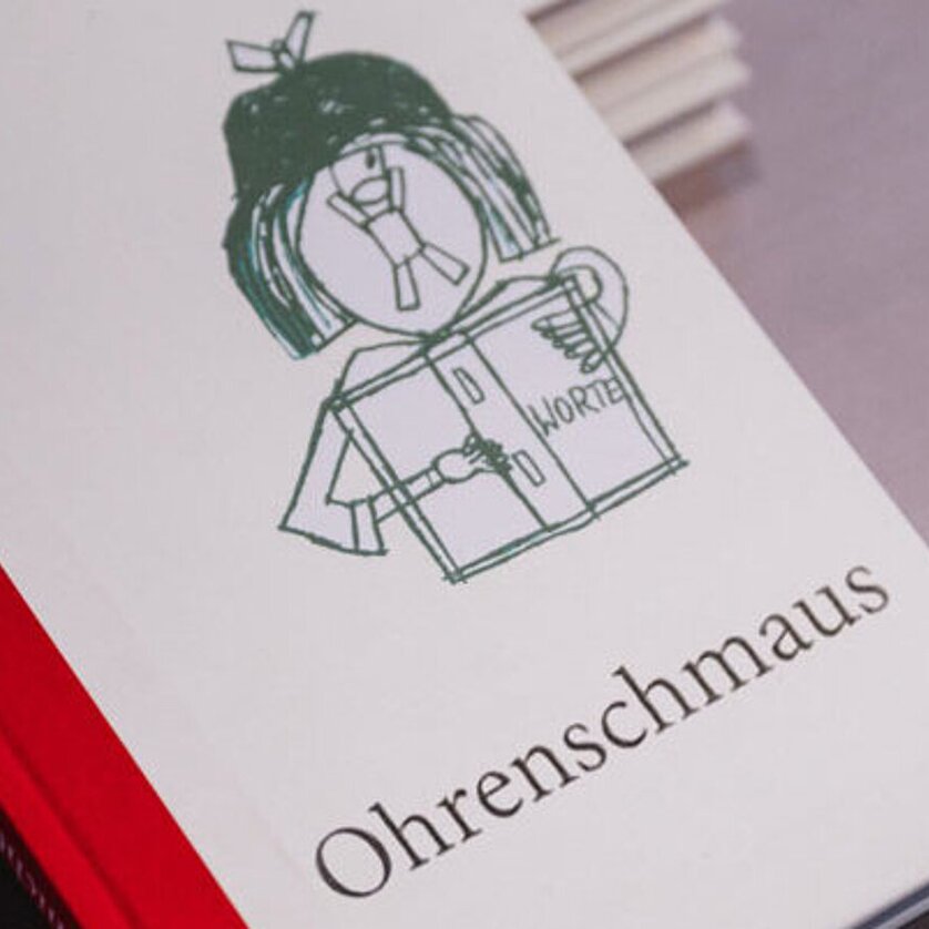 Buchcover mit einer Zeichnung und dem Titel 'Ohrenschmaus'. | © Verein Ohrenschmaus