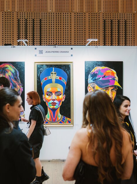 Visitors to Art Expo view colourful portraits. | © Katja Čemažar