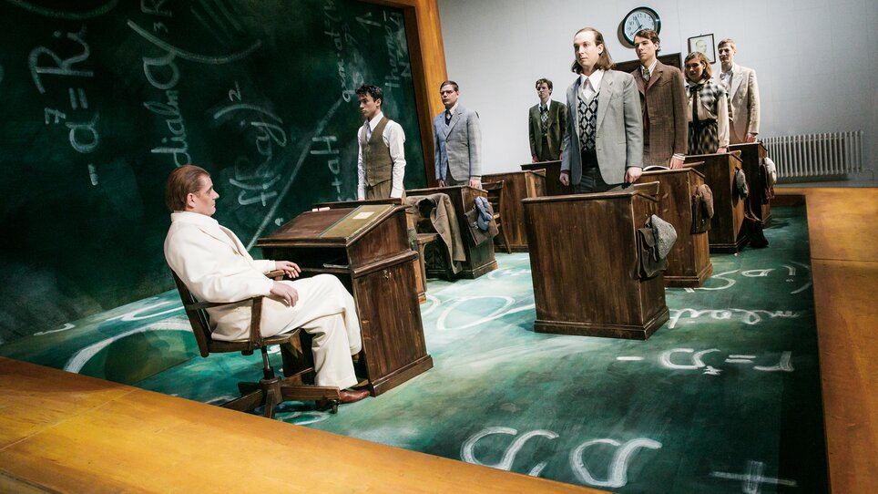 Next Liberty features desks arranged in a classic layout. The room has an academic atmosphere with mathematical equations on the wall. | © Lupi Spuma