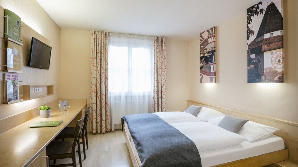 Gemütliches Hotelzimmer im JUFA Hotel Graz City für Geschäftsreisende. | © JUFA Graz City