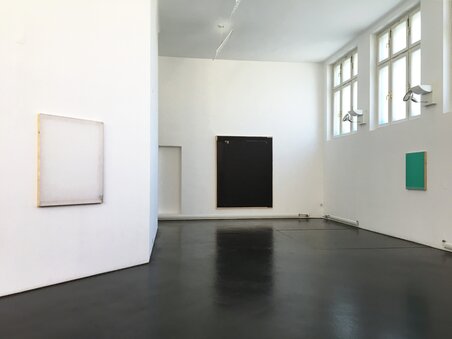 Minimalist art exhibit featuring four paintings. | © Photo Jaromír Novotný