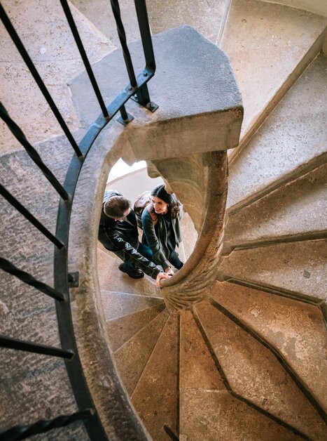 Two individuals ascend the famous double spiral staircase. | © Graz Tourismus