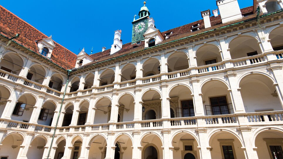 The Landhaus Courtyard in Graz featuring impressive architecture against a blue sky. | © Graz Tourismus - Harry Schiffer