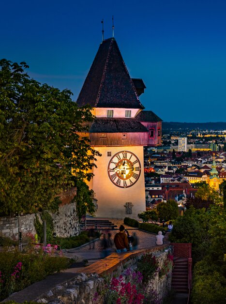 Graz clock tower overlooking the city at night. | © Graz Tourismus - Werner Krug