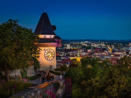 Graz clock tower overlooking the city at night. | © Graz Tourismus - Werner Krug