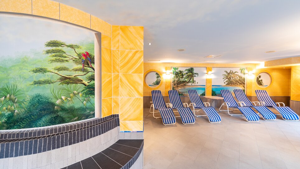 Interior of a wellness area with loungers and wall mural. | © Harry Schiffer
