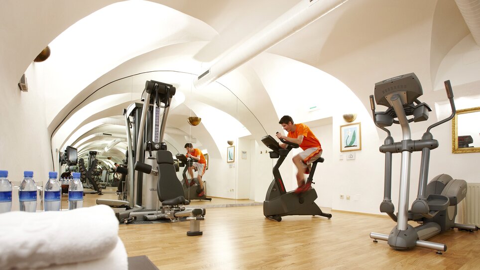 A modern gym featuring exercise equipment. | © Schlossberghotel